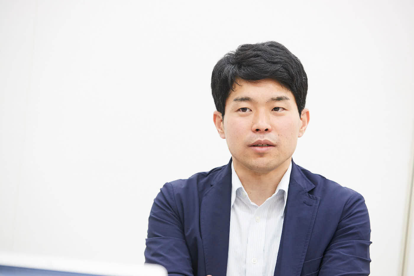 写真:『第三の居場所』の取り組みについて語る本山さん