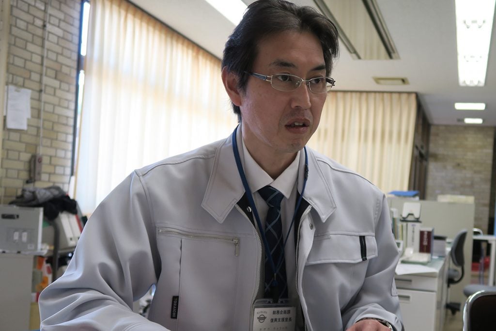 写真:被災当時について話す鋸南町の小川亮一復興支援室長の様子