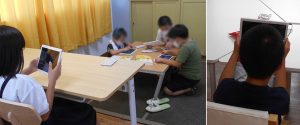 写真:タブレットを使う子どもたちの様子